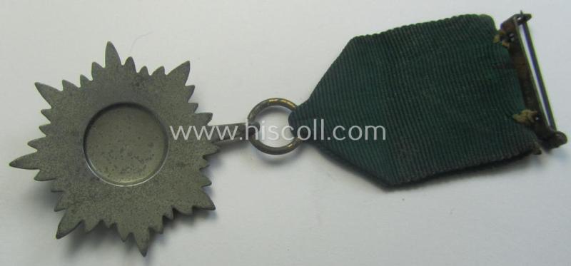 WH-related so-called: 'Verdienstauszeichnung für Angehörige der Ostvölker, 2. Klasse in Silber ohne Schwerter', being a typical non-maker-marked- and/or: 'Feinzink'-based example that comes mounted on its period ribbon