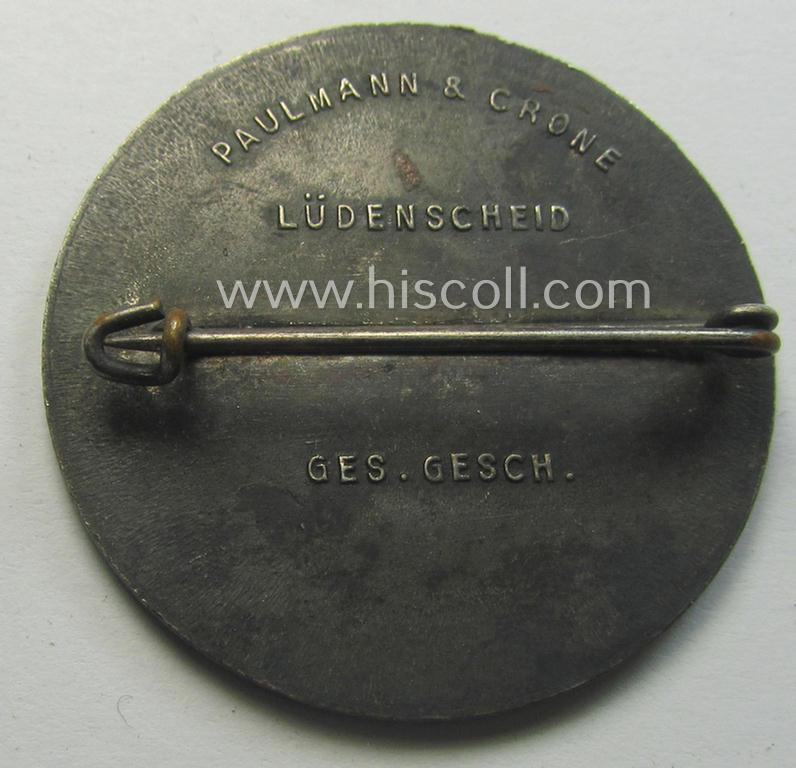 Commemorative - zinc-based- and/or silver-coloured - N.S.D.A.P.- (ie. WHW-) related 'tinnie', being a maker- (ie. 'Paulmann u. Crone'-) marked example depicting a portrait of Adolf Hitler surrounded by the text: 'Hitlers' Dank - Gau Westfalen N...