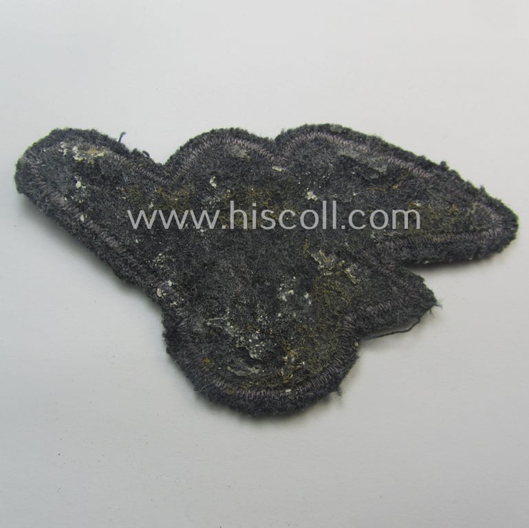 Moderately used, officers'-pattern, 'Luftschutz' (ie. RLB-) breasteagle being a neatly 'BeVo'-flat-wire'-woven example that is executed onto a bluish-grey-coloured- and/or woolen-based background