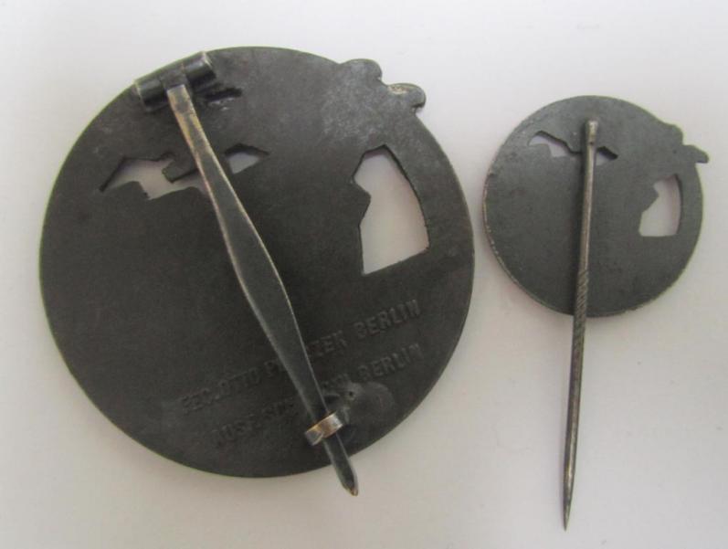 Attractive - and matching! - set comprising of a WH (KM) 'Blockadebrecher-Kriegsabzeichen' being a maker- (ie. 'Schwerin'-) marked example that comes together with its accompanying 'Halbminiatur', both pieces as executed in multi-coloured 'Feinzink'