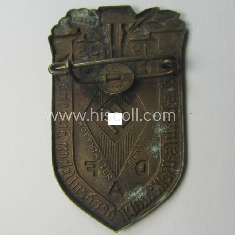 Commemorative, golden-bronze-toned, 'DAF'/'HJ'- (ie. 'Deutsches Arbeits Front o. Hitlerjugend'-) related 'tinnie' being a maker- (ie. 'Hofstätter'-) marked example depicting a: 'HJ-raute' and text: 'Reichs-Berufs-Wettkampf der deutschen Jugend 1935'