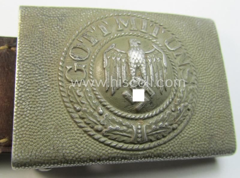 Superb, WH (Heeres) 'standard-pattern', field-grey-toned- and aluminium-based belt-buckle being a maker- (ie. 'Bernh. Haarmann'-) marked- and/or '1939'-dated example that comes mounted onto its (unit-stamped!) leather-based tab