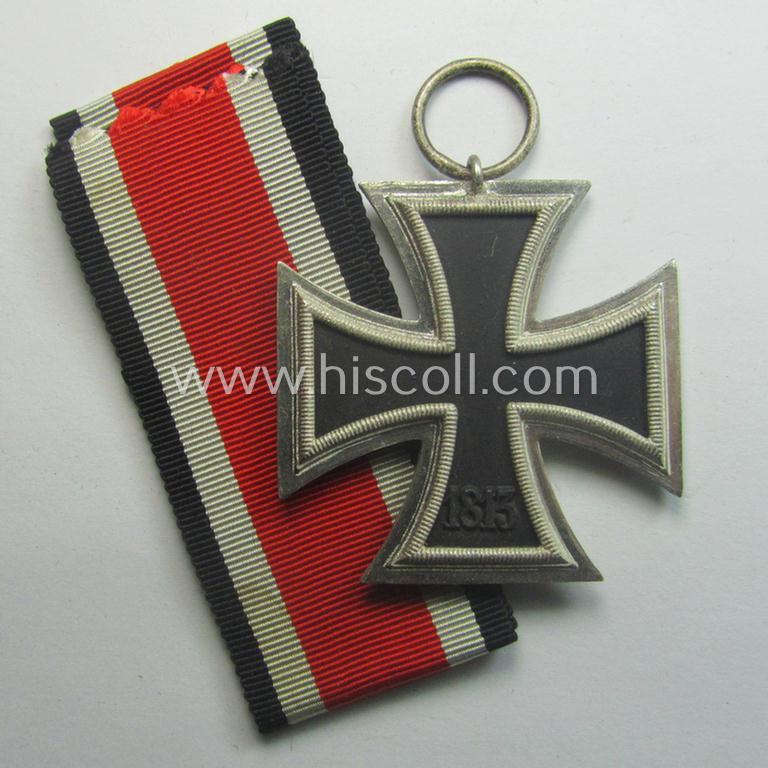 'EK II. Klasse' being a maker- (ie. '4'-) marked example that comes together with its original- and once-mounted ribbon (ie. 'Bandabschnitt') as was produced by the maker (ie. 'Hersteller'): 'Steinhauer u. Lück'