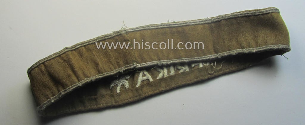 Cleary worn WH cuff-title (ie. 'Ärmelstreifen') entitled: 'Afrika' (being a minimally shortened example that comes in an overall very nice- (ie. issued and clearly worn ie. once tunic-attached-), condition