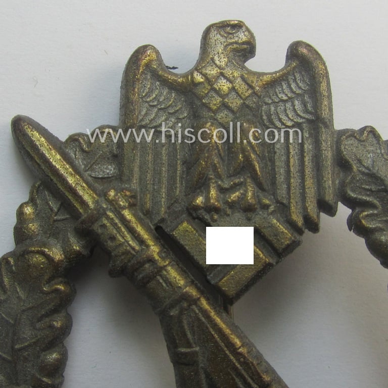 'Infanterie Sturmabzeichen in Bronze' being a maker- (ie. 'JFS'-) marked, 'solid-back' example by the desirable maker: 'Josef Feix u. Söhne' as was executed in golden-bronze-coloured, zinc-based metal
