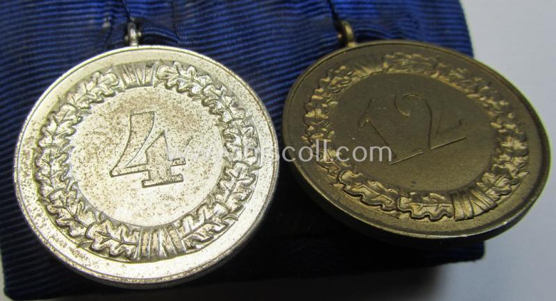 Attractive, two-pieced medal-bar (ie. 'Spange') showing two: WH (Heeres o. Kriegsmarine) so-called: 'Dienstauszeichnungen für 4 u. 12 Jahre Treue Dienste' that both come period-mounted as a so-called: 'Doppelspange'