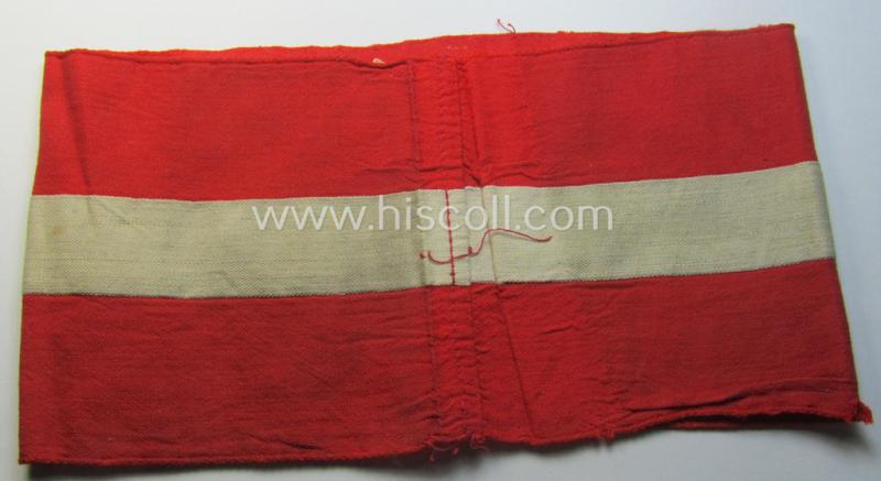 'Standard-issued'-pattern (ie. entirely woven) pattern, bright-red-coloured HJ- (ie. 'Hitlerjugend'-) related armband (ie. 'Armbinde') being a moderately worn- ie. used example that misses its 'RzM'-etiket