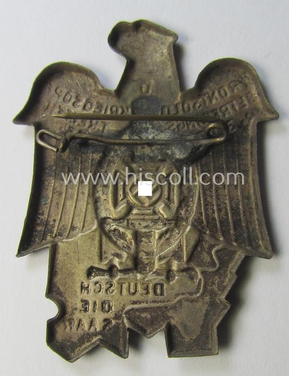 N.S.K.V.- (ie. 'Nationalsoz. Kriegsopferversorsung'-) related 'tinnie' being a non-maker-marked example showing an eagle-device and N.S.K.V.-logo and text that reads: 'Frontsold. u. Kriegsopf. Befreiungstreffen - 30.5. 35 - Deutsch die Saar'