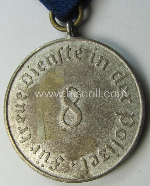 Bright-silver-toned so-called: 'Polizei-Dienstauszeichnung 3. Stufe' (or: police loyal-service medal 3rd class) that comes mounted onto its period ribbon (ie. 'Bandabschnitt')