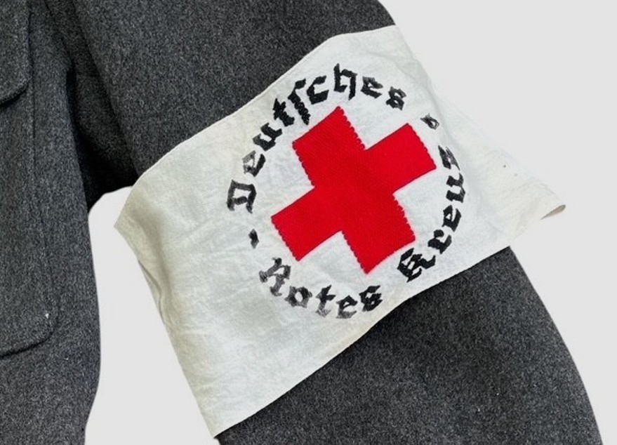 DRK (Deutsches Rotes Kreuz)  Vorhelfer service tunic with original insignia and armband.