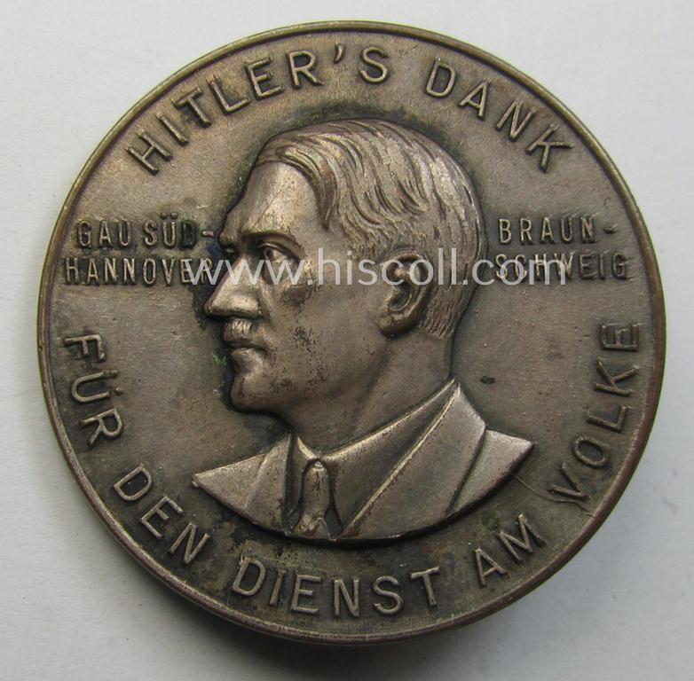 Commemorative, silvered 'Buntmetall'-based N.S.D.A.P.- (ie. WHW-) related 'tinnie' being a maker- (ie. 'Paulmann u. Crone'-) marked example depicting A. Hitler and text: 'Hitlers' Dank für den Dienst am Volke - Gau Süd-Hannover - Braunschweig...