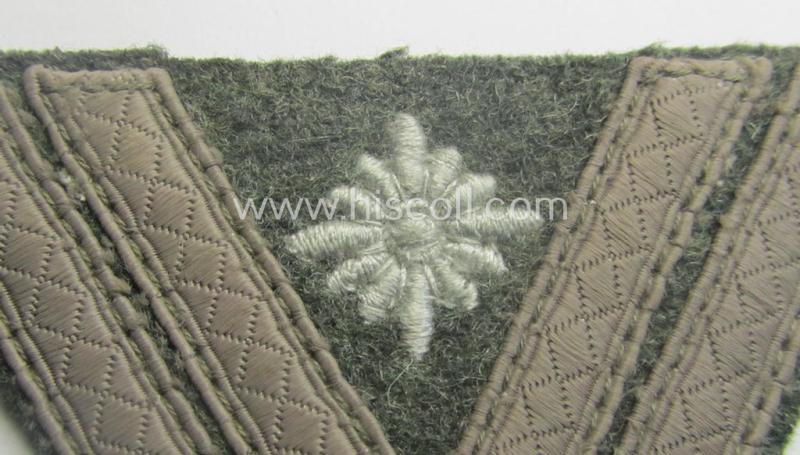 WH (Heeres) 'Armwinkel' (or: arm-chevron) as executed on typical field-grey-coloured wool as was specifically intended for usage by a soldier with the (unusually encountered!) rank of: 'Stabsgefreiter'