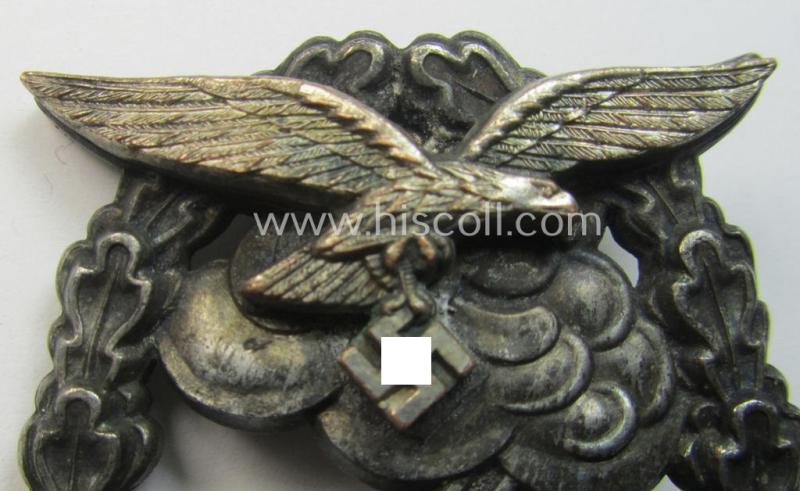 Mid- (ie. later-war-) period, zinc- (ie. 'Feinzink'-) based version of a WH (Luftwaffe) 'Erdkampfabzeichen' having a separate eagle-device attached and being a maker- (ie. 'G.B.' or 'Gustav Brehmer'-) marked example