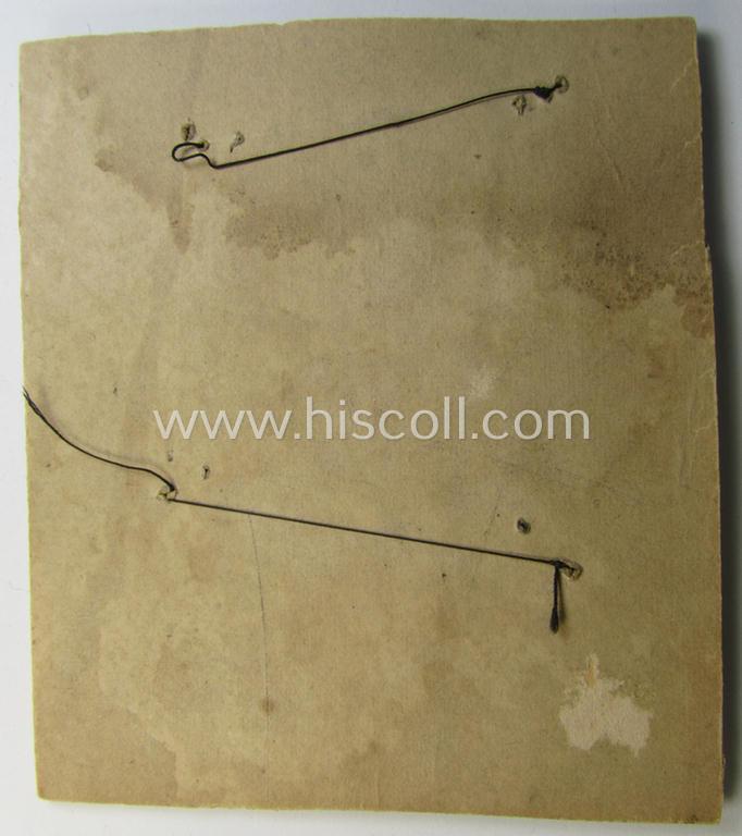 Unusual example of a neatly hand-embroidered WH (Kriegsmarine) trade- ie. special-career-patch (ie. 'Tätigkeitsabzeichen') as was intended for a: 'Geschützführer I' (and that comes as period-attached on a carton 'card')