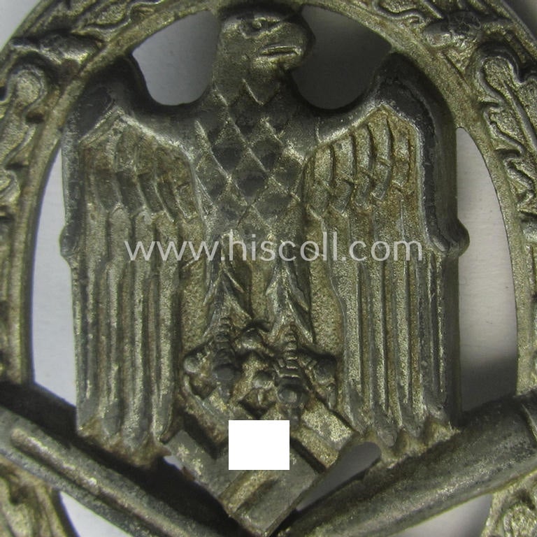 'Allgemeines Sturmabzeichen' (or: General Assault Badge ie. GAB) being a typical unmarked, zinc-based- (ie. 'Feinzink'-) and/or: 'semi-hollow-back'-version as was (I deem) produced by the: 'Rudolf Karneth'-company