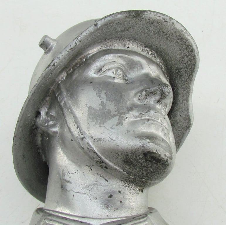 “German Wehrmacht soldier bust desk decoration on marble base.”