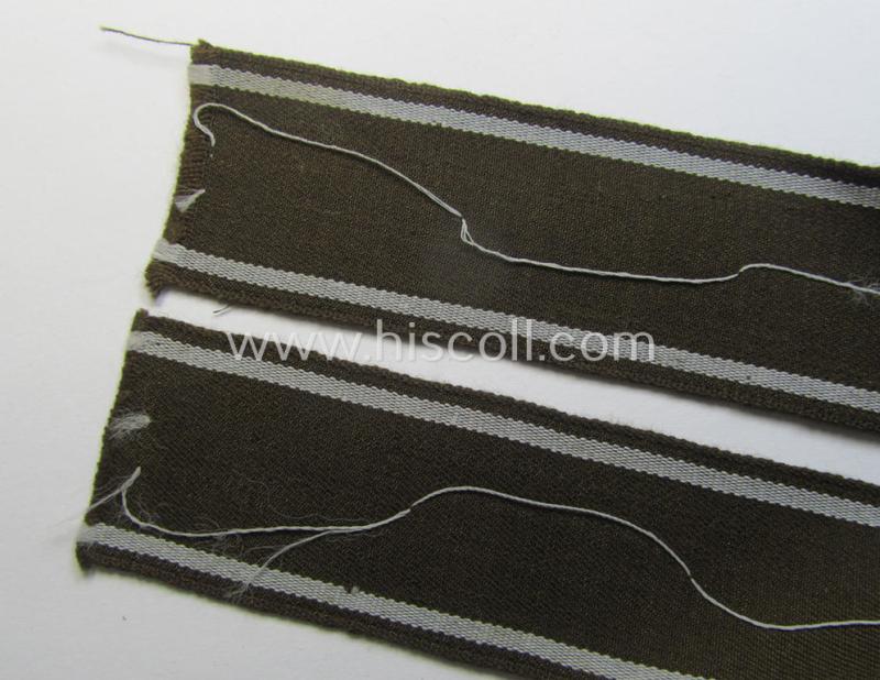 Superb - and scarcely encountered! - example of a WH (Heeres) cuff-title ie. armband (ie. 'Ärmelstreifen') entitled: 'Feldgendarmerie' (being a typical 'semi-BeVo'-woven!) example that comes in a full length- ie. non-shortened, condition