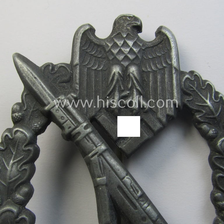 'Infanterie-Sturmabzeichen in Silber' (or: silver-class IAB) being a clearly maker- (ie. 'GWL'-) marked, zinc- (ie. 'Feinzink'-) version ie. molded-'variant' by the: 'Gebrüder Wegerhoff'-company