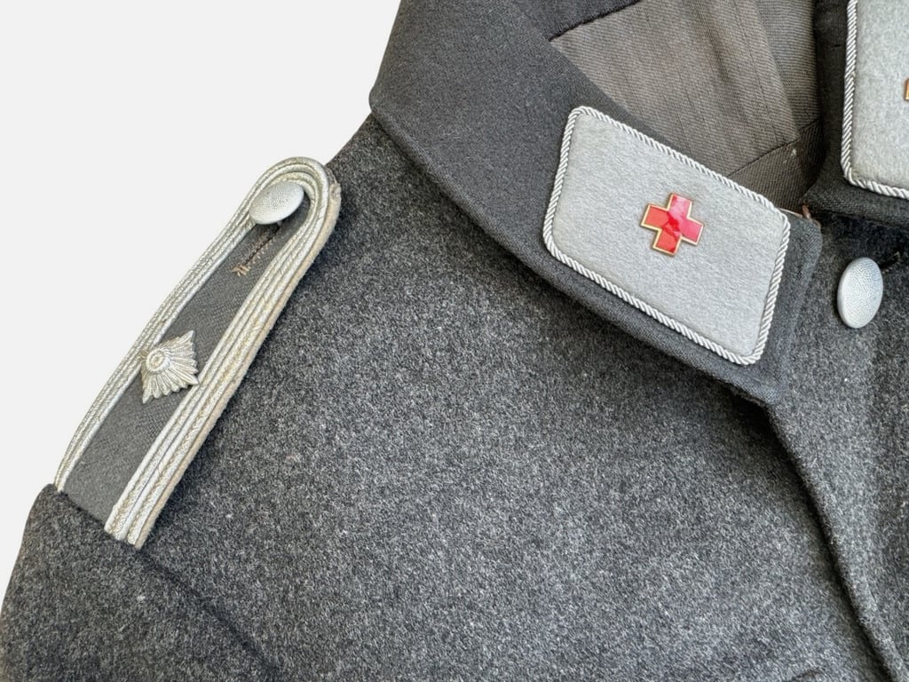 DRK (Deutsches Rotes Kreuz)  Vorhelfer service tunic with original insignia and armband.