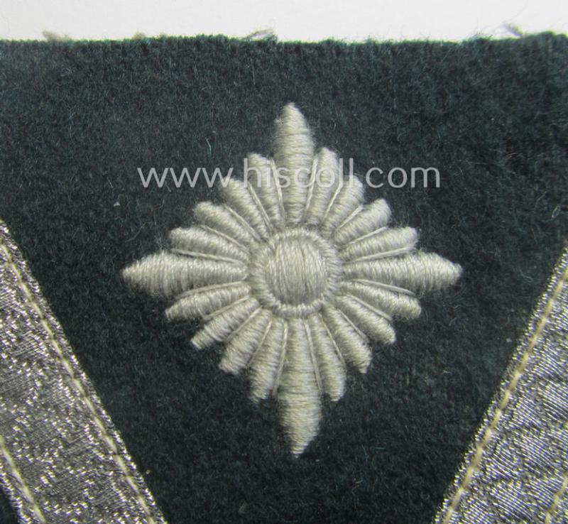 WH (Heeres) 'Armwinkel' (or: arm-chevron) as executed on typical darker-green-coloured wool as was specifically intended for usage by a soldier with the (unusually encountered!) rank of an: 'Gefreiter mit mehr als 6 Dienstjahren'