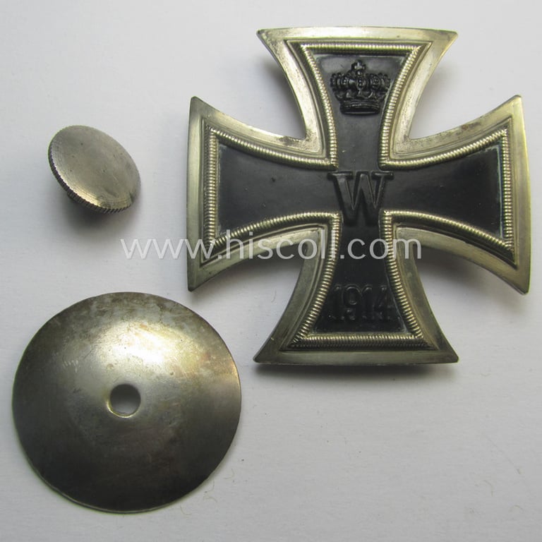 WWI-period Iron Cross 1st class (or: 'EK 1. Klasse') being a typical non-maker-marked example (by the 'C.E. Juncker'-company!) that comes mounted onto its (unusual!) and functional 'screw-back'- (ie. 'an der Schraube'-) set-up