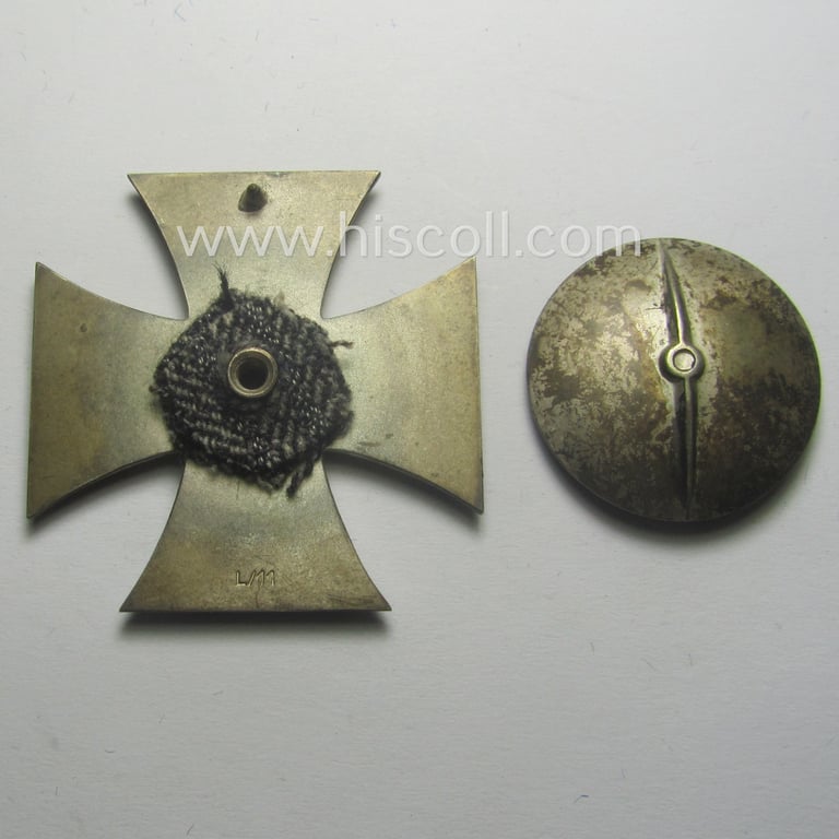 Stunning, 'EK 1. Klasse' (or: Iron Cross 1st class) as executed in the scarcely seen so-called: 'screw-back'-pattern being a maker- (ie. 'L/11'-) marked example that comes stored in its accompanying (and equally marked!) etui as issued