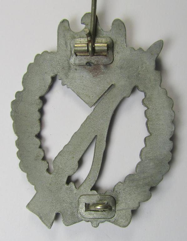 'Infanterie-Sturmabzeichen in Silber' being a non-maker-marked- and/or zinc- (ie. 'Feinzink'-) based specimen of the so-called: 'pillow-crimped'-pattern (as was produced by a to date still unidentified maker)