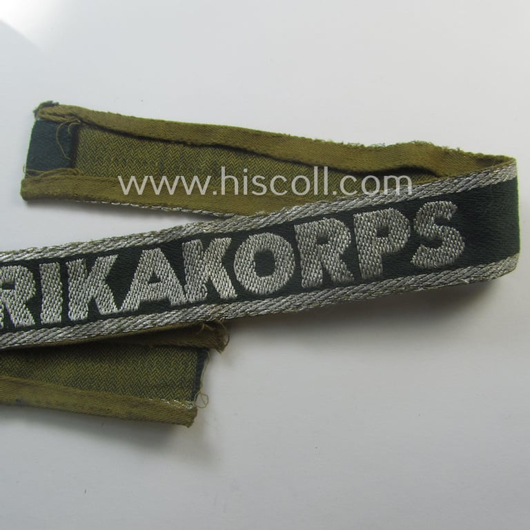 Truly worn, 'BeVo'-like cuff-title (ie. 'Ärmelstreifen') entitled: 'Afrikakorps' being a with certainty issued example that comes in an overall very nice- (ie. non-shortened- and/or once tunic-attached-), condition