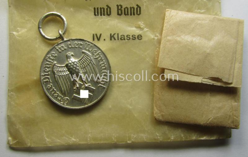 Superb - and usually seen! - WH (Luftwaffe) bright-silver-toned, 'WH-DA der 4. Klasse für 4 Jahre Dienstzeit' that comes with its accompanying ribbon (ie. 'Bandabschnitt') and eagle-device as stored in its period 'Cellophan'-based pouch