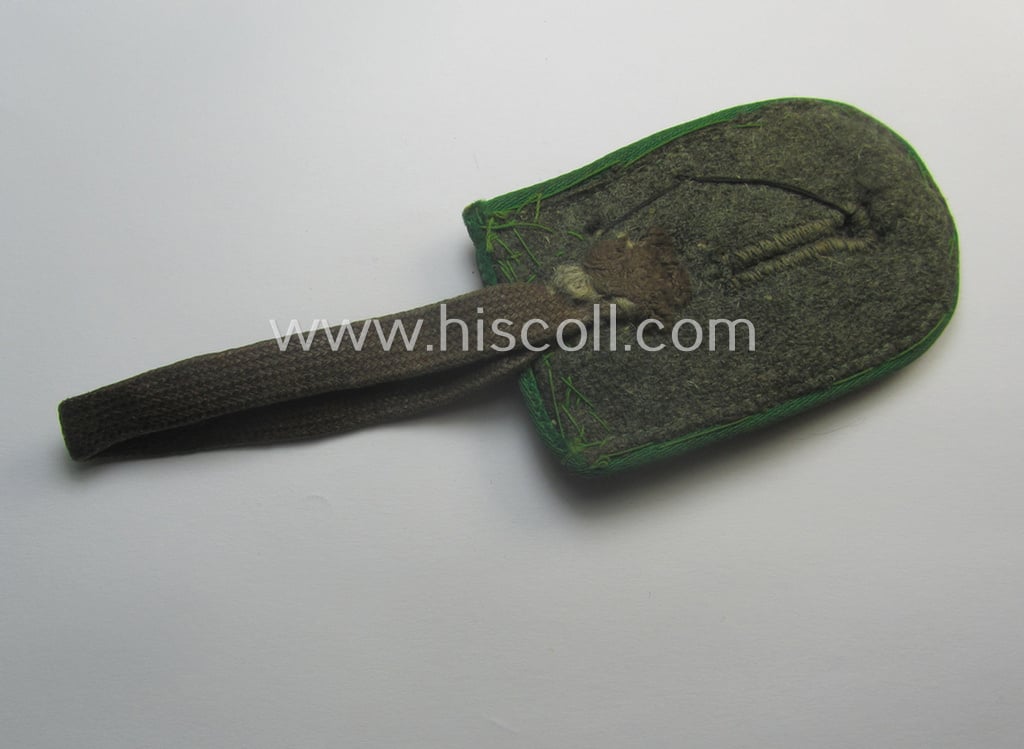 Never before seen, WH 'Gebirgsjäger'-related item: a semi-official, commemorative-talisman or: 'Url' that is privately-constructed from a (cut-off) shoulderstrap and zinc-based: 'Edelweiss'-M43 cap-badge