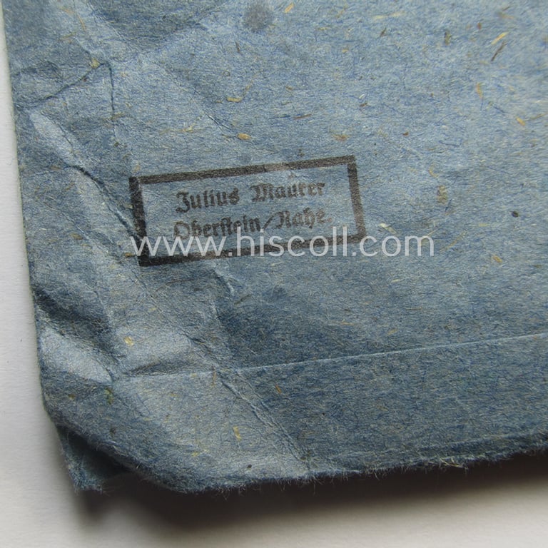 Superb - and very rarely found! - 'Eisernes Kreuz 2. Kl.' (ie. Iron Cross 2nd Class) being a maker- (ie. '75'-) marked example that comes stored in its period 'Zellstoff'-based pouch by the: 'Julius Maurer'-company