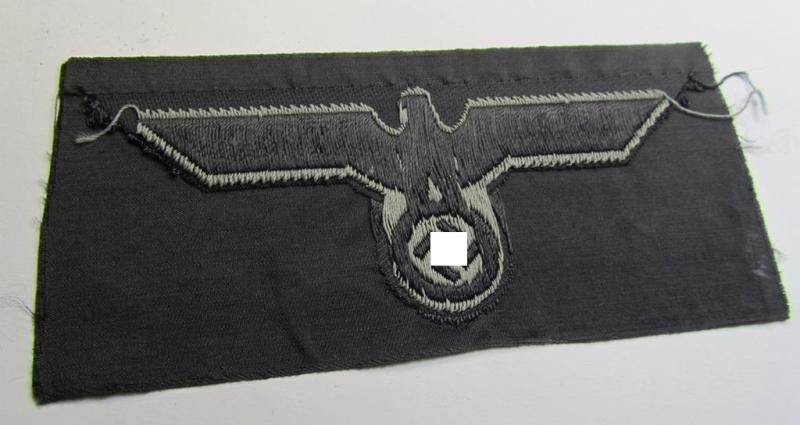 Later- (ie. mid-war-) period, WH (Heeres) 'Panzer'-type breast-eagle (ie. 'Brustadler für Panzertruppen') being a 'virtually mint- ie. unissued' example as executed in bluish-grey-coloured linnen on a black-coloured background