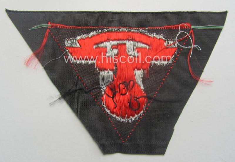 Never used - ie. 'virtually mint'! - so-called: N.S.K.K. (ie. 'National Soc. Kraftfahr Korps') side-cap-eagle (ie. 'Adler für Schiffchenmütze') being a 'flat-wire-woven'-example that comes mounted onto a bright-red-coloured background