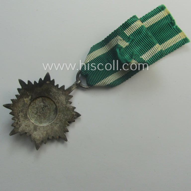 WH-related 'Tapferkeitsauszeichnung für Angehörige der Ostvölker, 2. Kl. in Silber mit Schwn.' (being a 'Feinzink'-based example that comes mounted onto its period ribbon ie. 'Bandabschnitt')