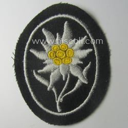 Waffen-SS-pattern, black-coloured sleeve-insignia (ie. 'Ärmelabzeichen') depicting an: 'Edelweiss'-flower...