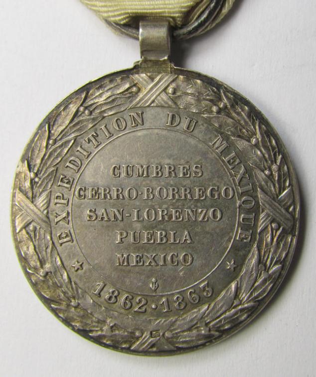 Attractive French, 'Second Empire-period', so-called: 'Expedition to Mexico'-campaign-medal (ie. 'Médaille Commémorative de l'Expédition du Mexique') that comes mounted on its period-ribbon as issued