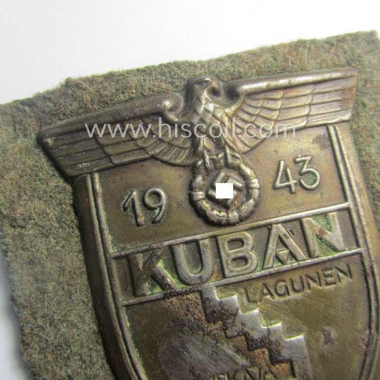 Truly worn, WH (Heeres ie. Waffen-SS) 'Kuban'-campaign-shield that comes mounted onto its original field-grey-coloured- and/or woolen-based 'backing' as issued and/or used