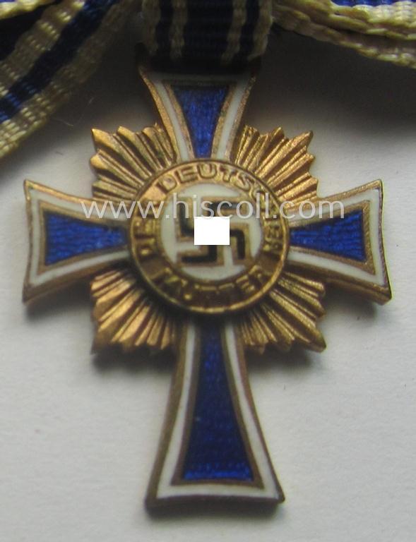 Miniature of an: 'Ehrenkreuz der deutschen Mutter - erste Stufe' (or: golden-class mothers'-cross) being a non-maker-marked example that comes in an overall nice- (albeit moderately worn- ie. used-), condition