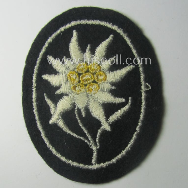 Waffen-SS-pattern, black-coloured sleeve-insignia (ie. 'Ärmelabzeichen') depicting an: 'Edelweiss'-flower as used by the various 'Gebirgsjäger'- (ie. mountain-troops-) related divisional-staff