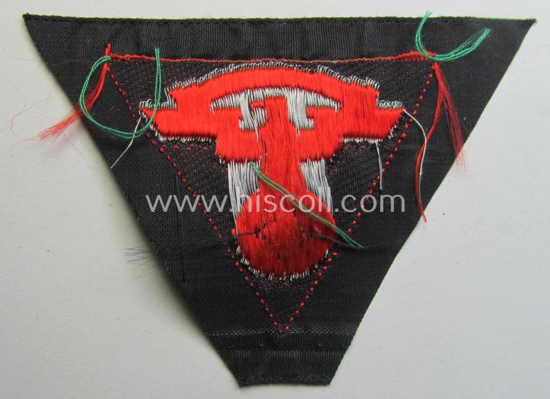 Attractive - and 'virtually mint'! - so-called: N.S.K.K. (ie. 'National Socialistisches Kraftfahr Korps') side-cap-eagle (ie. 'Adler für Schiffchenmütze') being a 'flat-wire-woven'-example that comes mounted onto a bright-red-coloured backgro...