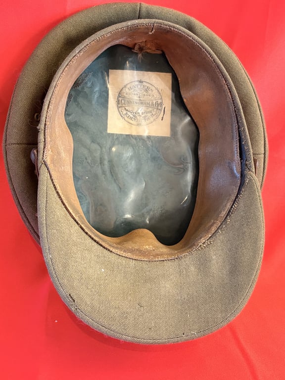 BRITISH WWII WILTSHIRE REGIMENT OFFICERS VISOR CAP, BELT AND CROSS STRAPS.
