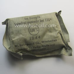 WH (Heeres, Luftwaffe etc.) greyish-beige-coloured- and/or rubberised-linnen-based bandage-package...