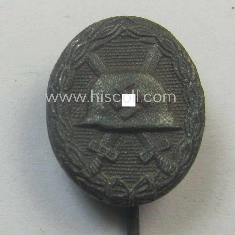 Neat - and 17 mm. sized! - miniature lapel-pin (ie. 'Halbminiatur') depicting a: 'Verwundeten-Abzeichen in Silber' (or: silver-class wound-badge) being a non-maker-marked example