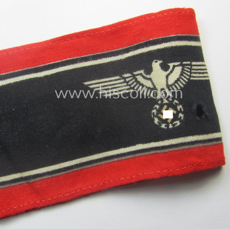 Moderately worn example of a (typically printed- and/or later-war-period) bright-red- and/or black-coloured so-called: 'Deutscher Volkssturm'-armband (ie. 'Armbinde') that comes in an overall nice condition