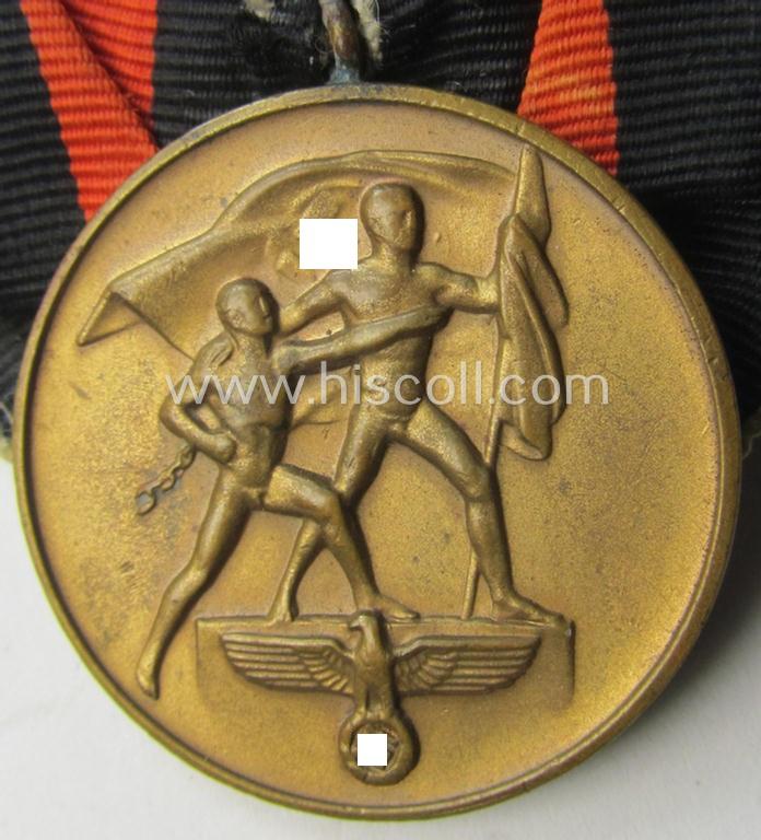 Bright golden-toned WH (Heeres o. KM etc.) so-called: 'Einzelspange' showing a WH Czech 'Anschluss'- (ie. occupation-) medal: '1 October 1938'
