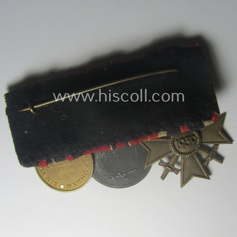 3-pieced WH (Heeres etc.) medal-bar (ie.: 'Ordenspange') showing resp. a: 'KvK II.Kl. mit Schwn.', an: 'Ost'-medal and a Czech 'Anschluss'-medal: '1. Oktober 1938'