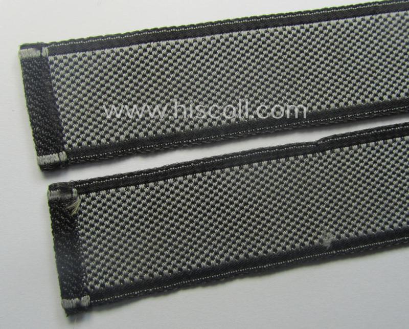 Waffen-SS, 1943-pattern cuff-title (ie. 'Ärmelstreifen') depicting the machine-woven Latin script text in silver-grey linnen as was intended for a member of the: 'SS-Geb.Jäg.-Rgts. 6. (u.11.)': "Reinhard Heydrich"