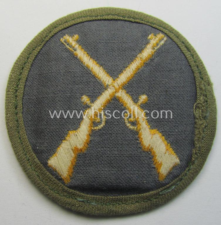 WH (Heeres) 'tropical'-issue, trade- and/or special-career insignia (ie. machine-embroidered 'Laufbahn- o. Tätigkeitsabzeichen') as was intended for an army: 'Waffenmeister' (or weapon-equipment NCO)