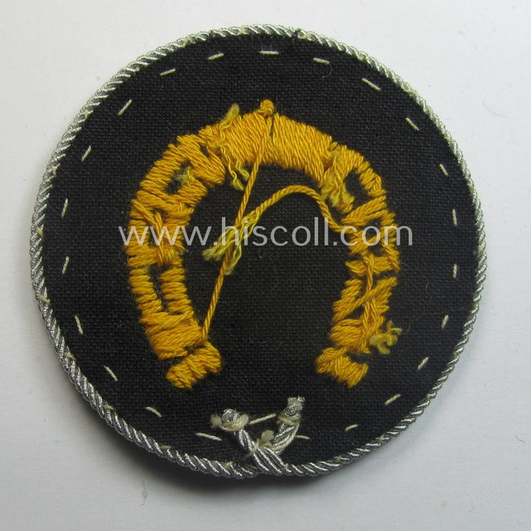 WH (Heeres) so-called: trade- and/or special-career arm-insignia (ie. 'Laufbahn- o. Tätigkeitsabzeichen') as intended for a: 'Hufbeschlagmeister' (or farrier) being a machine-embroidered 'variant'