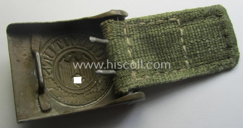 WH (Heeres) 'tropical-issued' belt-buckle being a non-maker-marked, field-grey-coloured example that comes mounted onto its original, greenish-coloured- (and/or: 'webbing'-based-) tab
